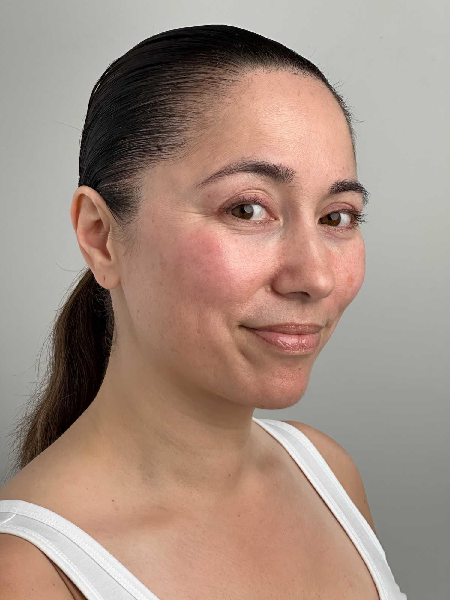 Clinical testing panelist posing in side profile, looking toward the camera